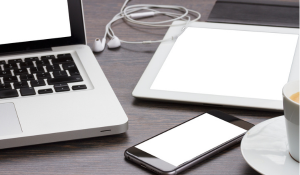 Laptop, cell phone and tablet on the table