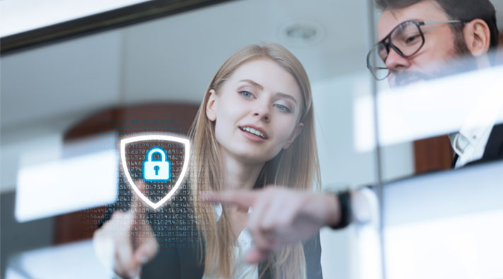 Two people pointing at the digital security lock