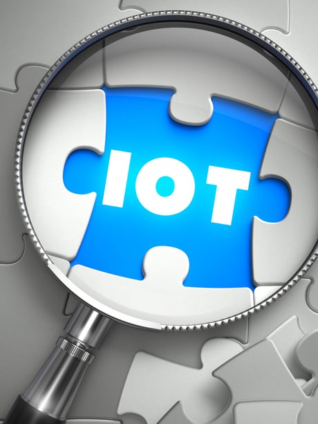 IOT - Word on the Place of Missing Puzzle Piece through Magnifier. Selective Focus.