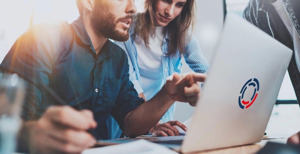 Two people in front of laptop